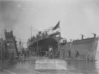 16-4 -DUPONT stern view in drydock showing sharp double-ender waterline. US Navy Photo NH-63748