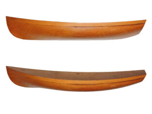 Two views of the half model for the Columbia dinghy on a white background, one showing the profile and the other slightly from above showing the shape of the sheer